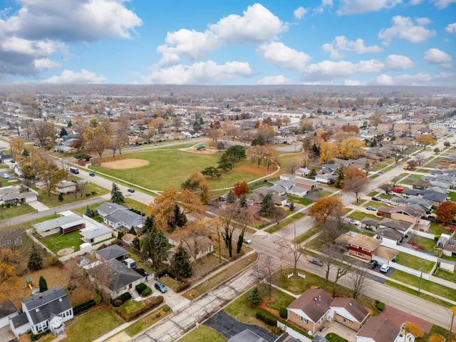 an aerial view of city and lake