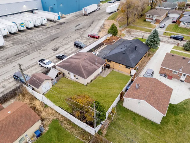 an aerial view of a house with a garden