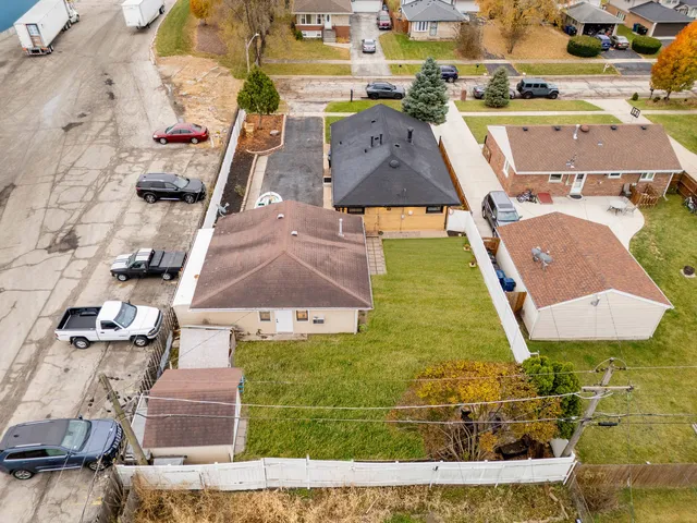 an aerial view of residential houses with outdoor space