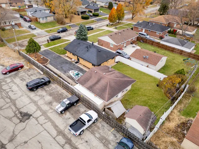 an aerial view of a house with a swimming pool