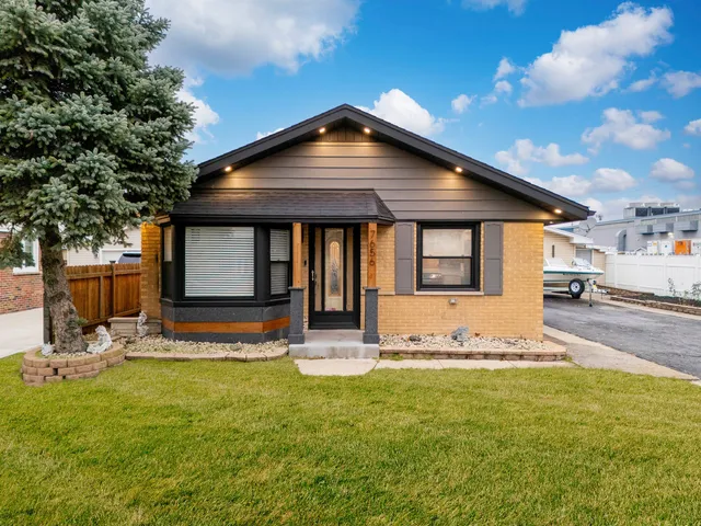 a front view of a house with a yard table and chairs