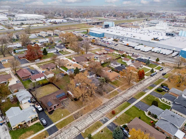 an aerial view of residential houses with outdoor space
