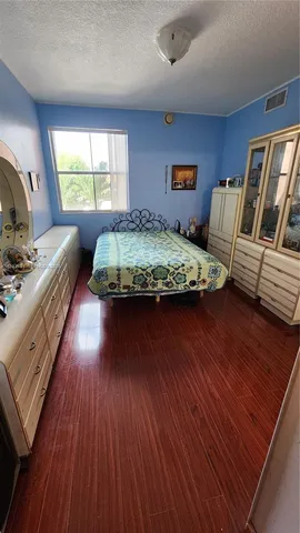 a bedroom with bed and window