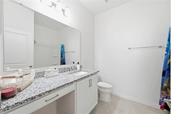 a bedroom with baby toys and a flat screen tv