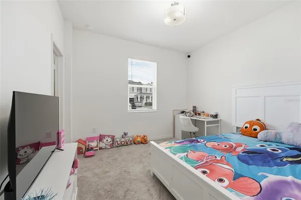 a room with a table chairs and wooden floor