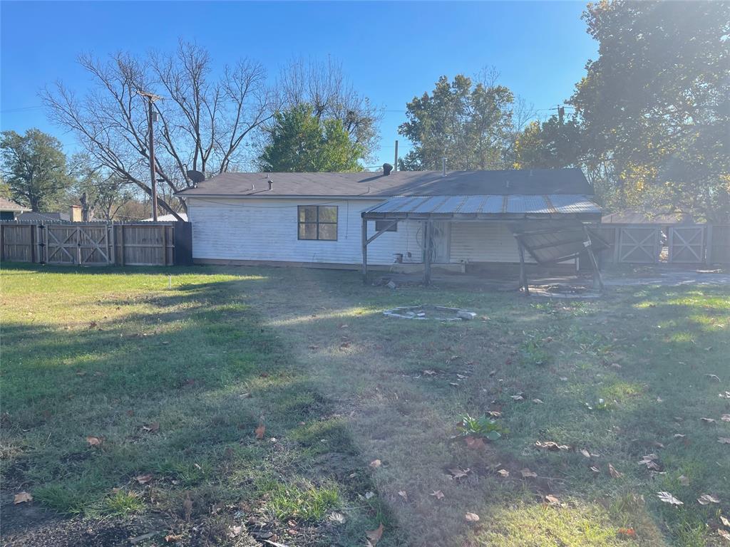 301 Walnut Street Chandler, TX 75758 - Photo 13 of 13 a view of a house with a yard