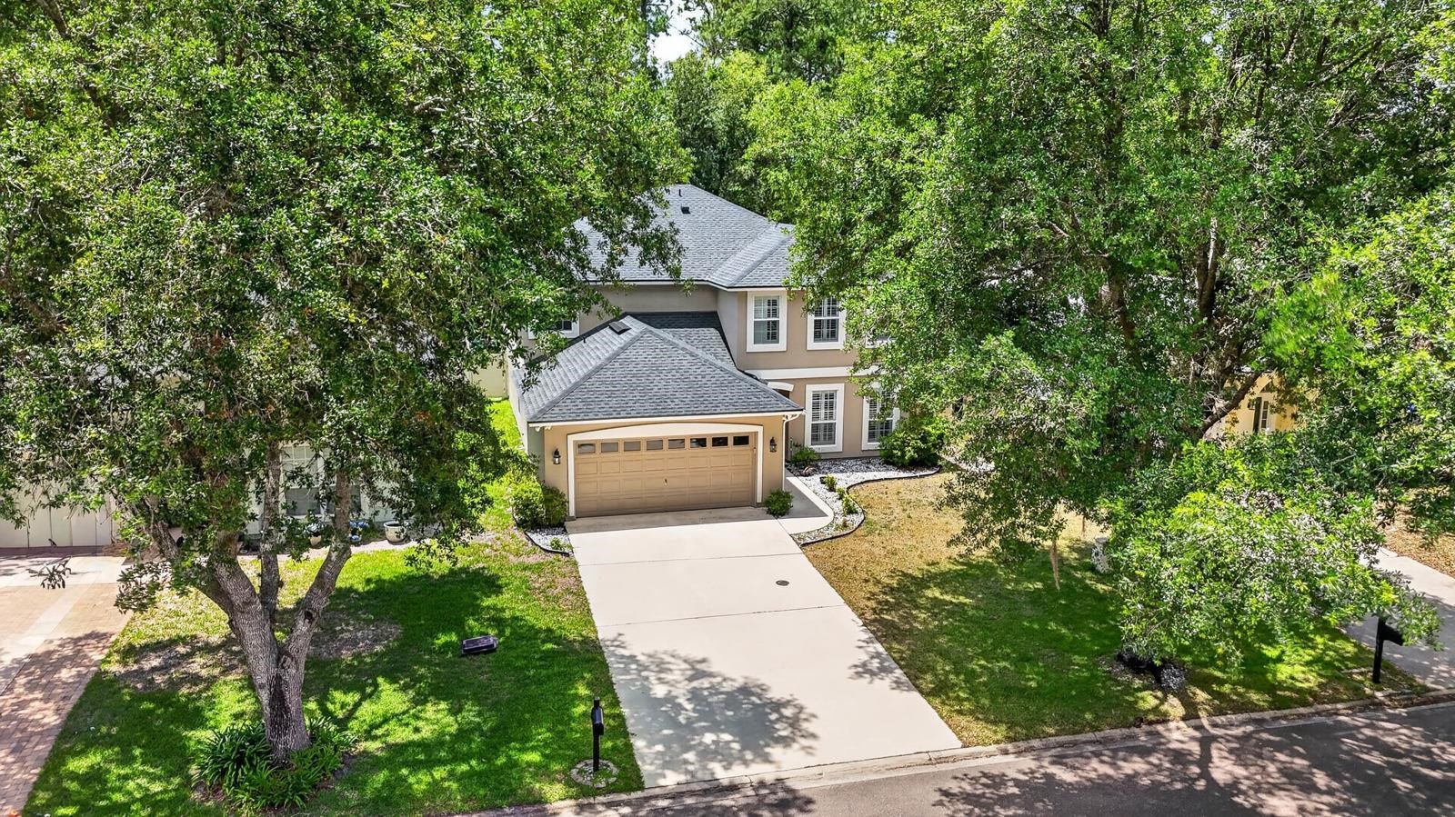1237 Splendid Ravine Street St. Augustine, FL 32092 - Photo 37 of 62 a front view of a house with a yard and garage