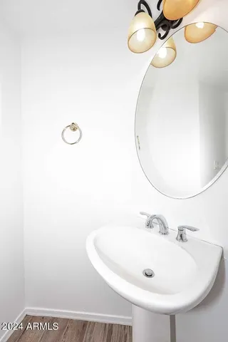 a bathroom with a sink and mirror