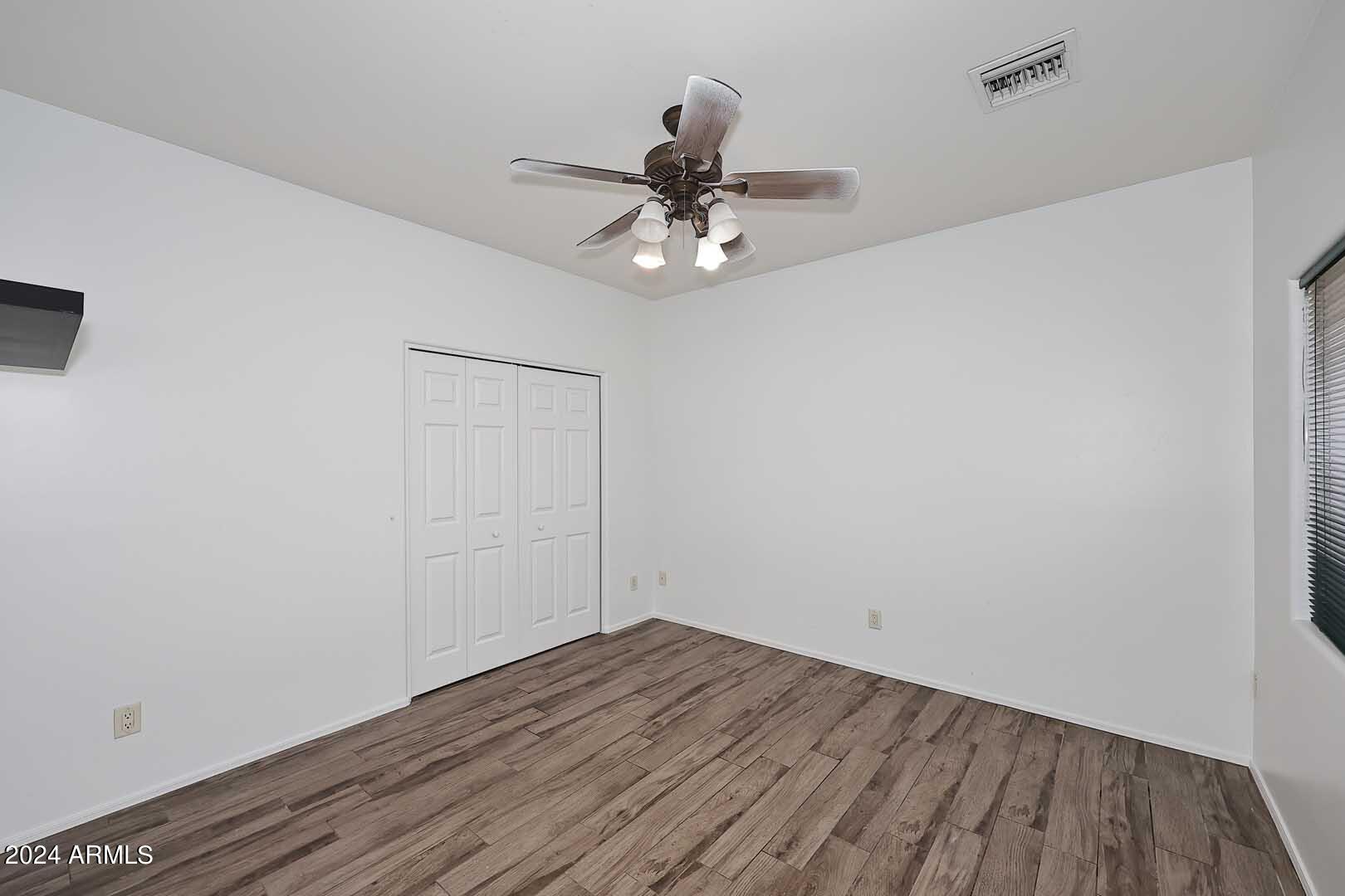 6006 North 5th Place Phoenix, AZ 85014 - Photo 19 of 34 a view of empty room with wooden floor