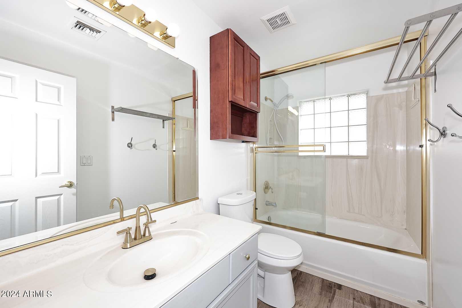 6006 North 5th Place Phoenix, AZ 85014 - Photo 20 of 34 a bathroom with a sink a toilet and shower