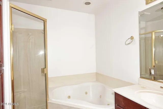 a bathroom with a bathtub and a sink