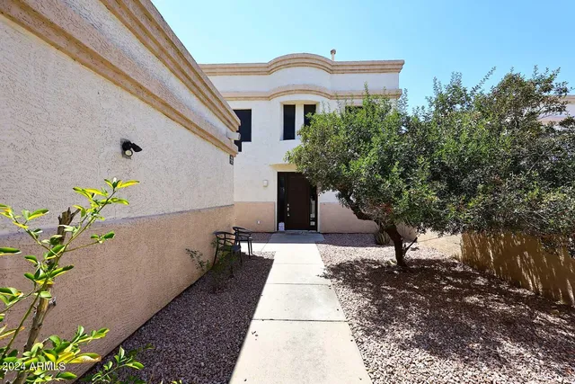 a house with trees in front of it