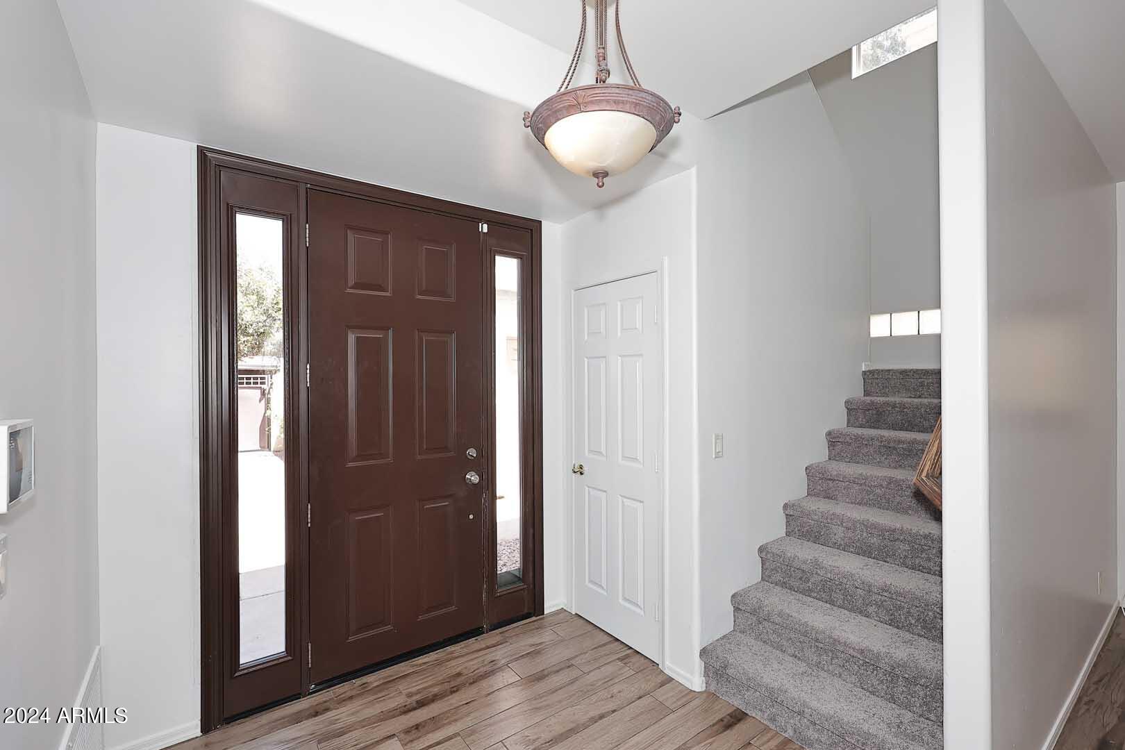 6006 North 5th Place Phoenix, AZ 85014 - Photo 5 of 34 a view of an entryway with wooden floor