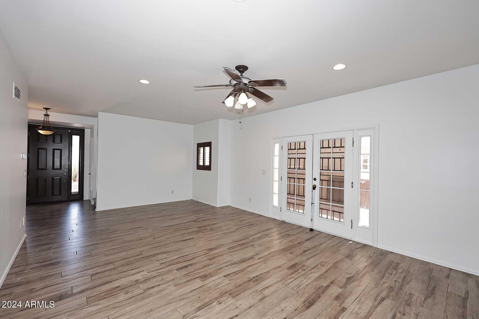 6006 North 5th Place Phoenix, AZ 85014 - Photo 7 of 34 wooden floor in an empty room with a window