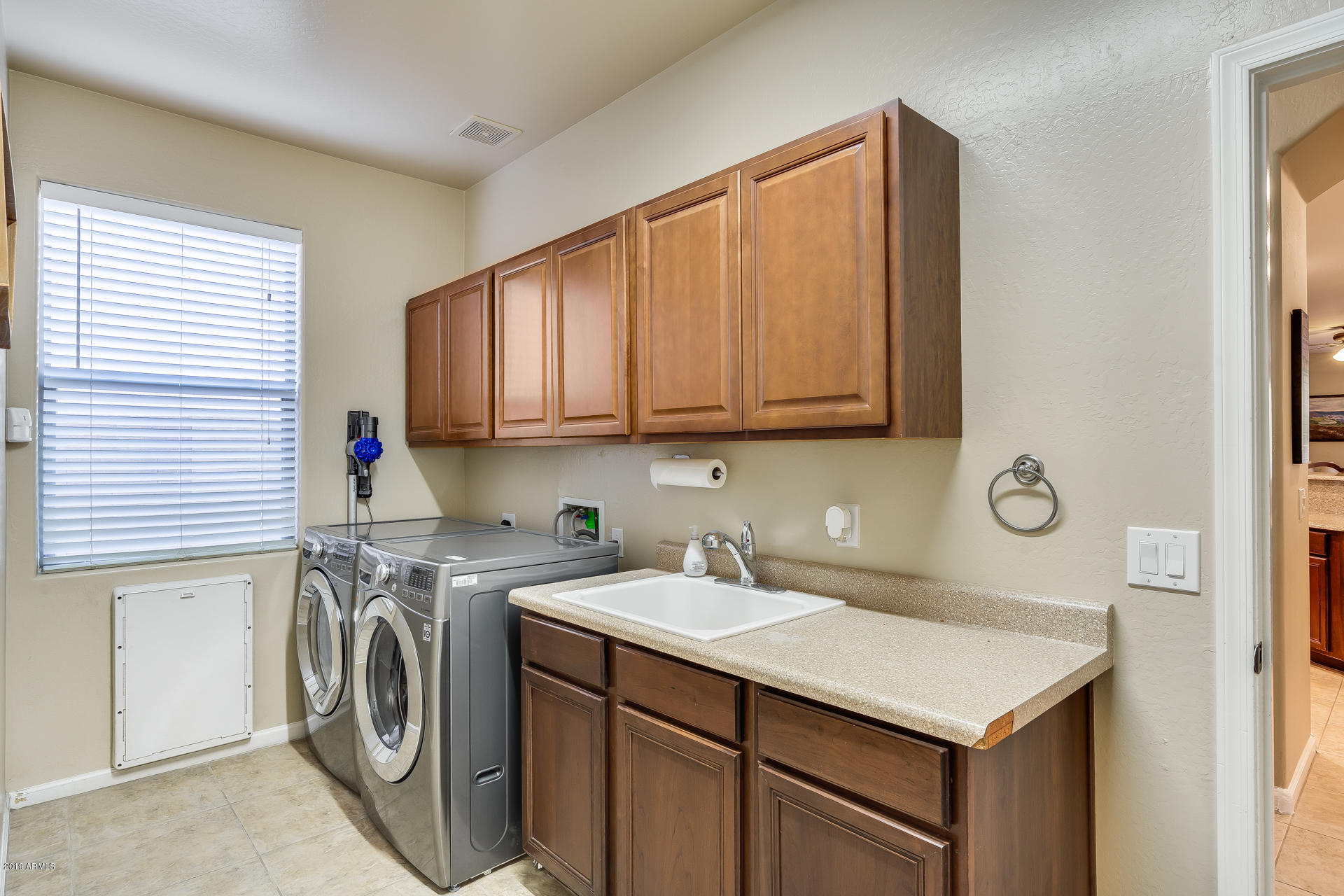 2028 West Caleb Road Phoenix, AZ 85085 - Photo 28 of 57 a utility room with sink dryer and washer