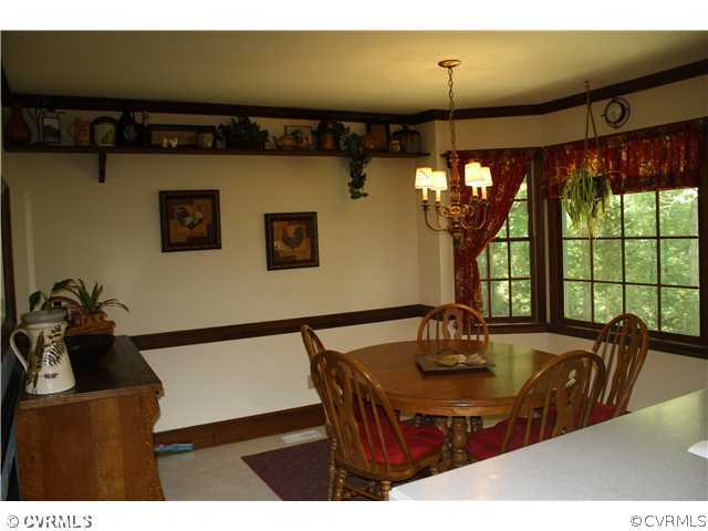 14720 Swift Water Road Chesterfield, VA 23838 - Photo 9 of 12 a view of a dining room with furniture and window