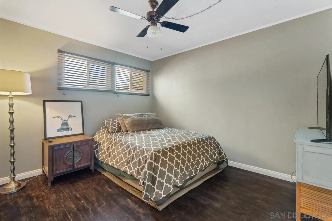 497 Mountain View Road El Cajon, CA 92021 - Photo 13 of 30 a bedroom with a bed and a window