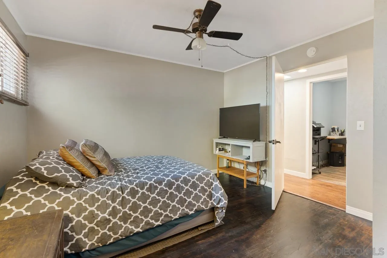 497 Mountain View Road El Cajon, CA 92021 - Photo 14 of 30 a bedroom with a bed and flat screen tv