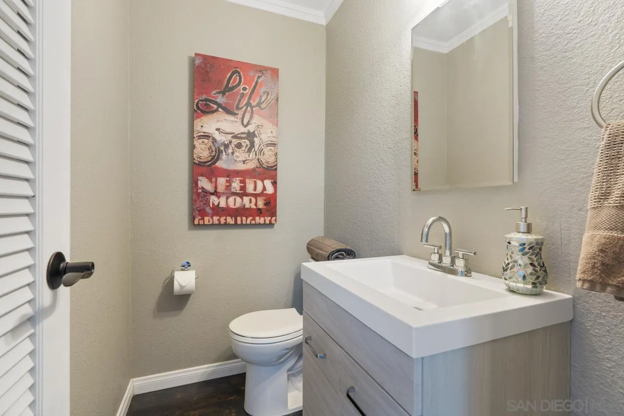 497 Mountain View Road El Cajon, CA 92021 - Photo 15 of 30 a bathroom with a sink and a toilet