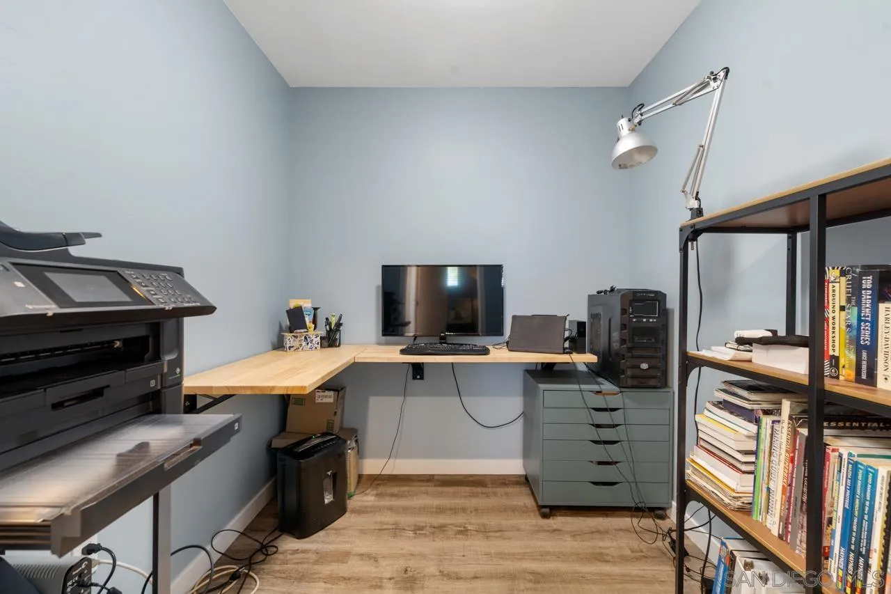 497 Mountain View Road El Cajon, CA 92021 - Photo 16 of 30 a view of a kitchen with cabinets and wooden floor