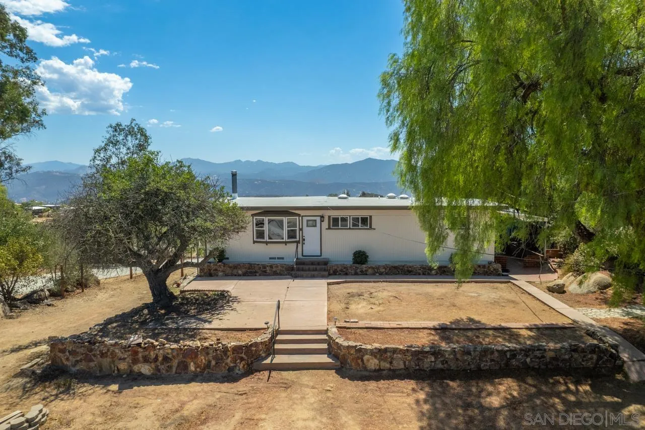 497 Mountain View Road El Cajon, CA 92021 - Photo 2 of 30 a view of a house with a yard