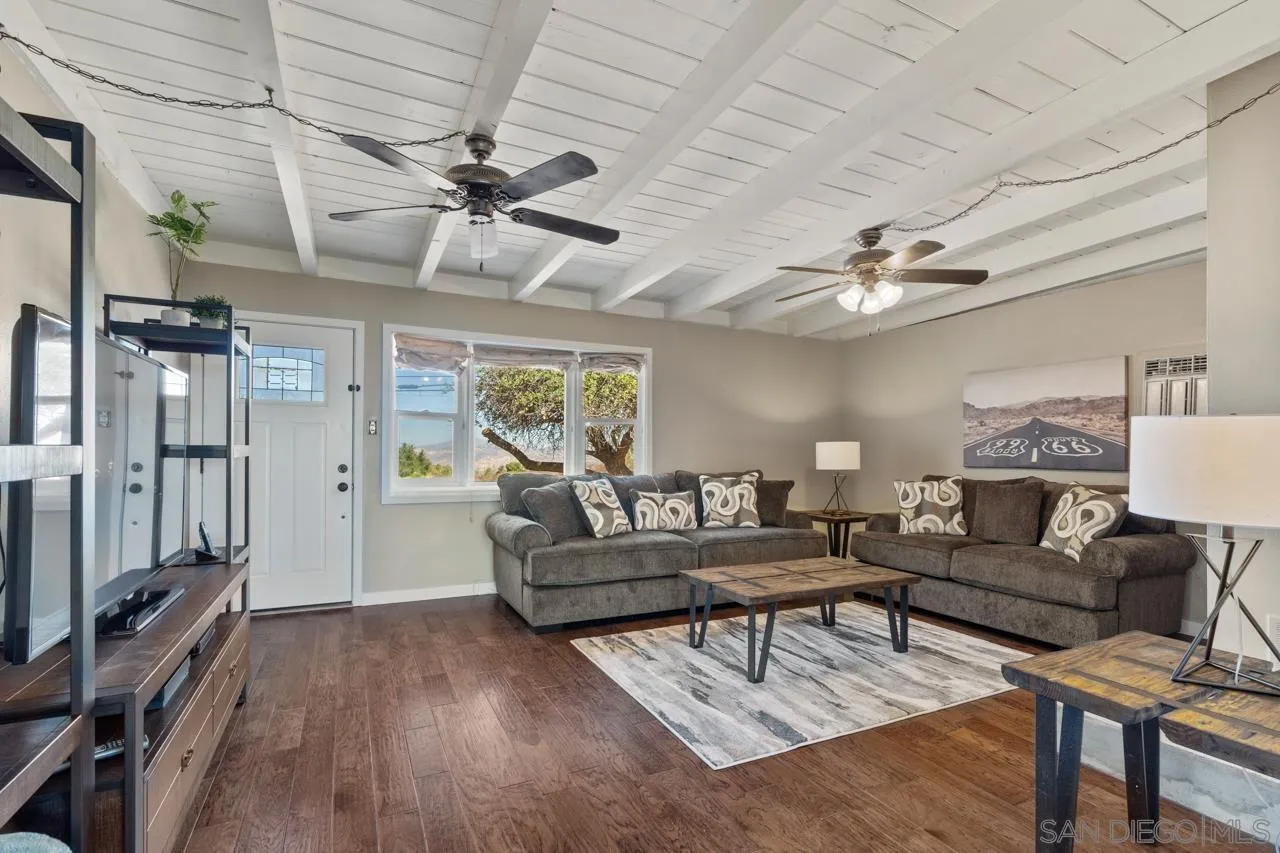 497 Mountain View Road El Cajon, CA 92021 - Photo 3 of 30 a living room with furniture and a chandelier