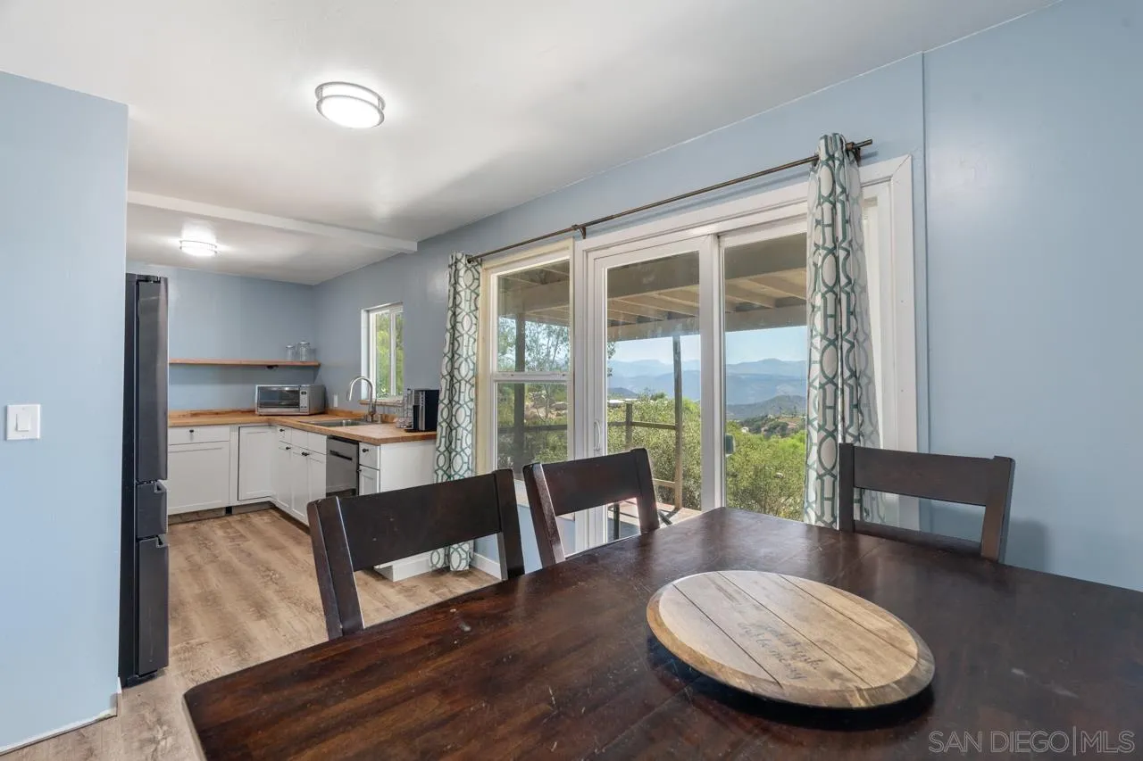 497 Mountain View Road El Cajon, CA 92021 - Photo 6 of 30 a living room with furniture and a large window