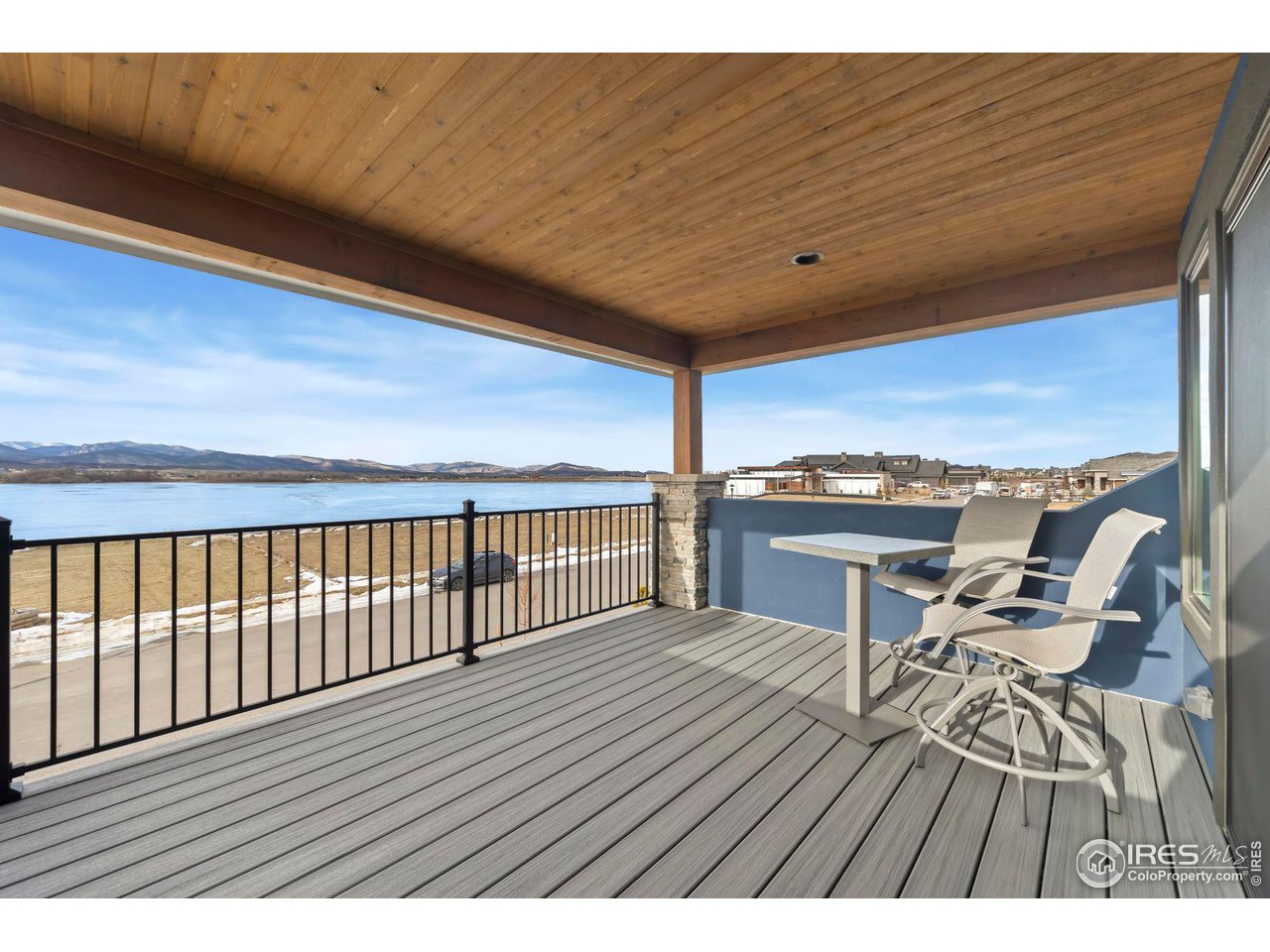 2648 Bluewater Road Berthoud, CO 80513 - Photo 27 of 36 Deck off the loft study with views of mountains and Lonetree Reservoir