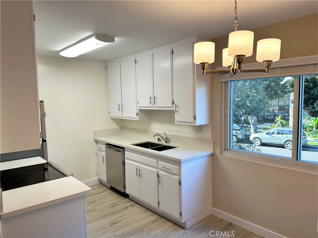 a kitchen with a sink and cabinets