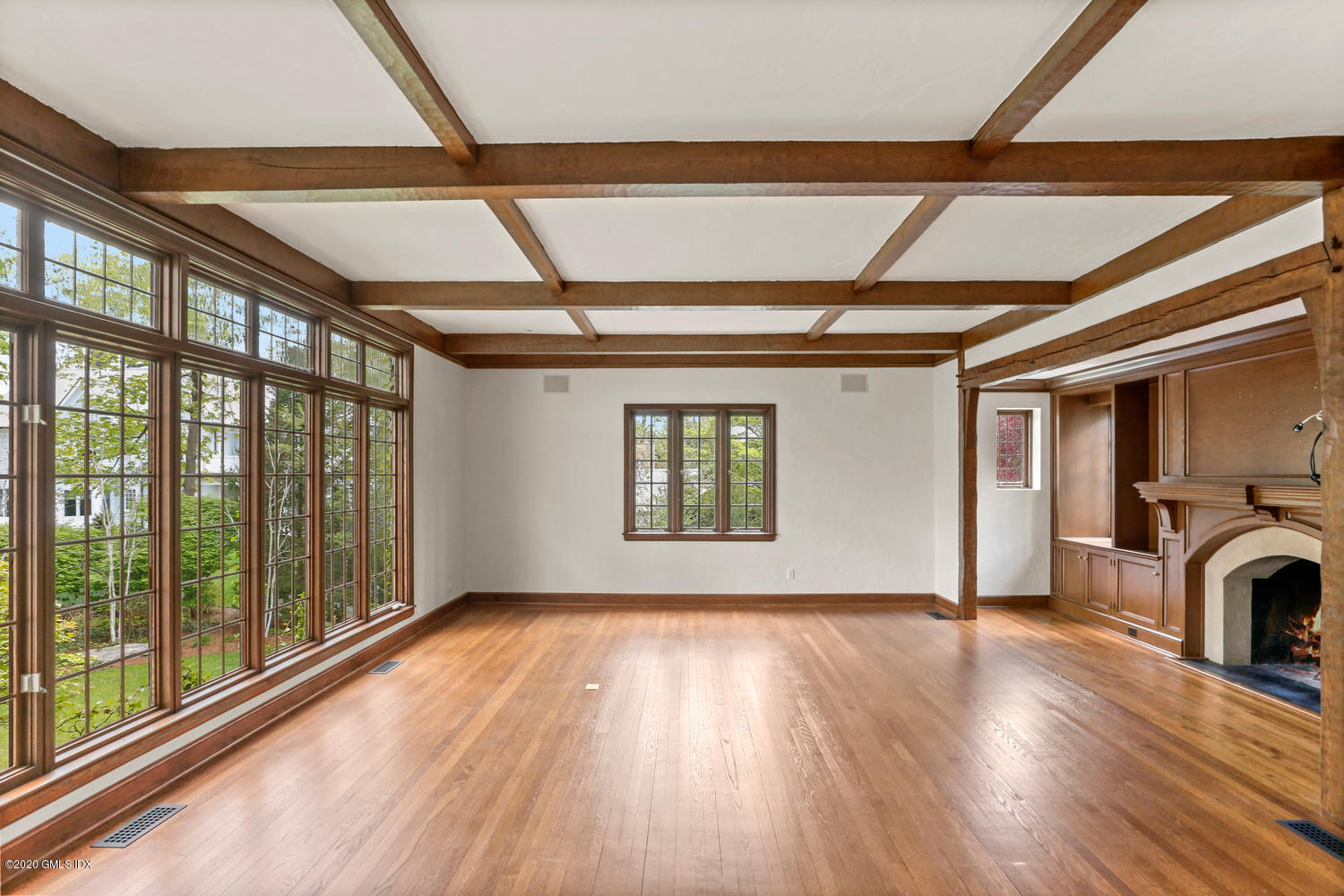 1 Spring Road Greenwich, CT 06830 - Photo 13 of 45 a view of livingroom with wooden floor and a large window