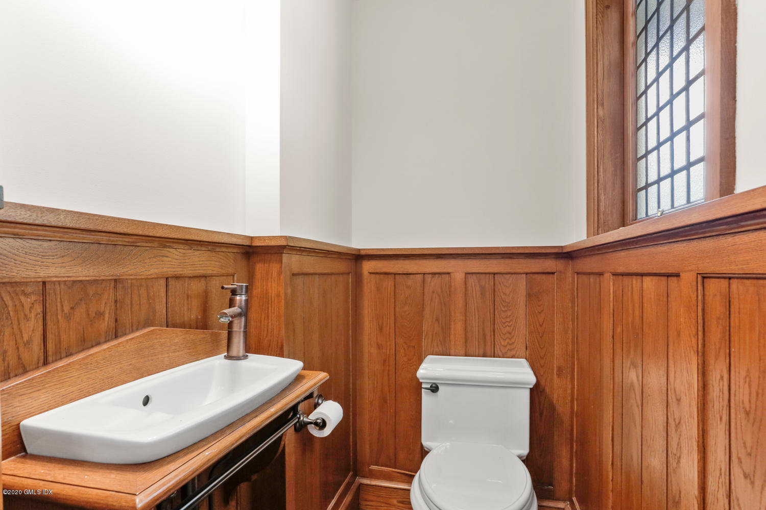 1 Spring Road Greenwich, CT 06830 - Photo 16 of 45 a bathroom with a sink a toilet and mirror