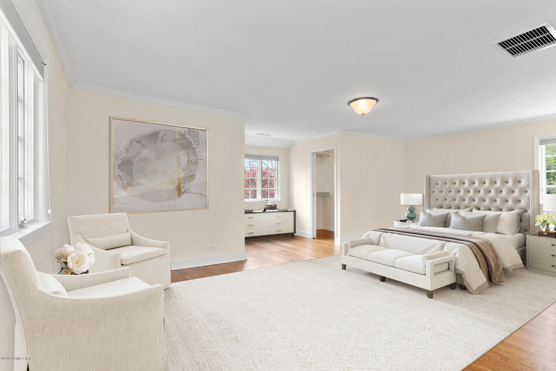 1 Spring Road Greenwich, CT 06830 - Photo 18 of 45 a spacious bedroom with a bed and a couch