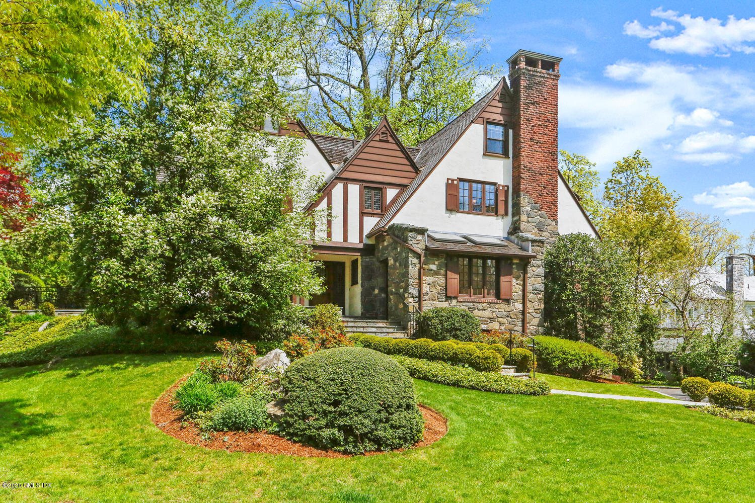 1 Spring Road Greenwich, CT 06830 - Photo 2 of 45 a front view of a house with a yard