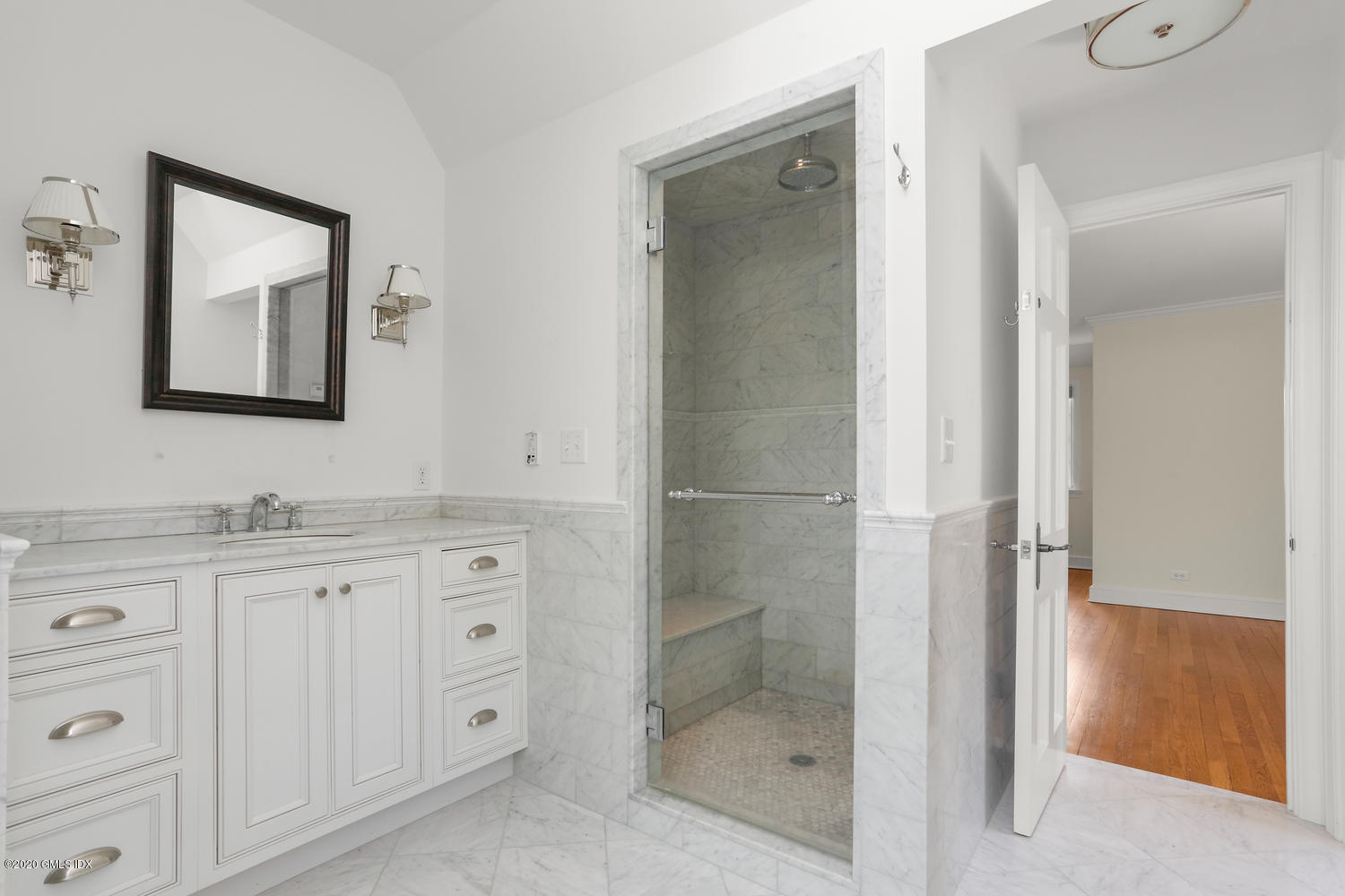 1 Spring Road Greenwich, CT 06830 - Photo 24 of 45 a bathroom with a granite countertop sink two mirror and shower