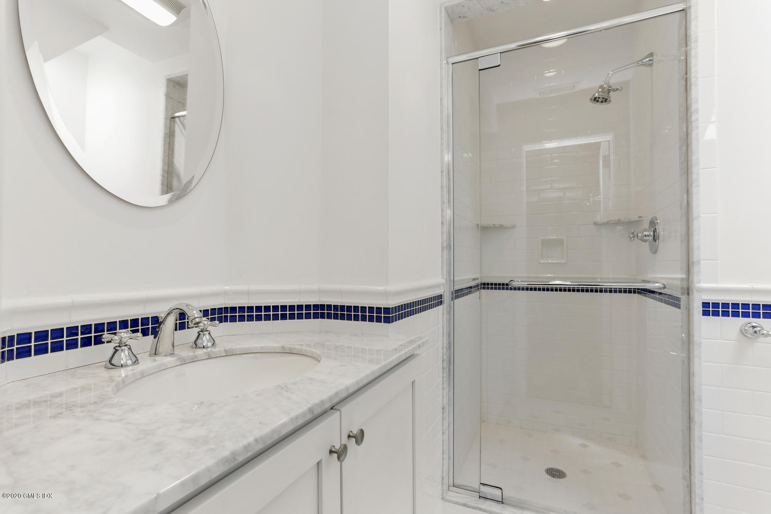 1 Spring Road Greenwich, CT 06830 - Photo 26 of 45 a bathroom with a granite countertop sink mirror and a shower