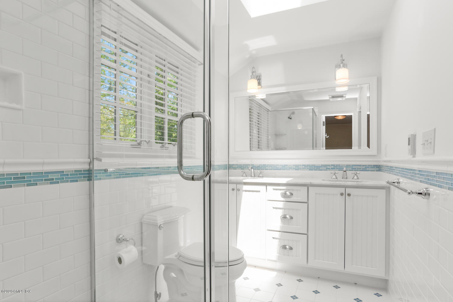 1 Spring Road Greenwich, CT 06830 - Photo 29 of 45 a bathroom with a shower sink and mirror