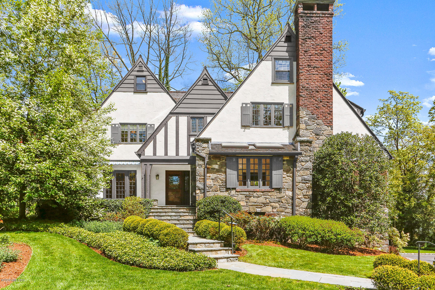 1 Spring Road Greenwich, CT 06830 - Photo 3 of 45 a front view of a house with a yard