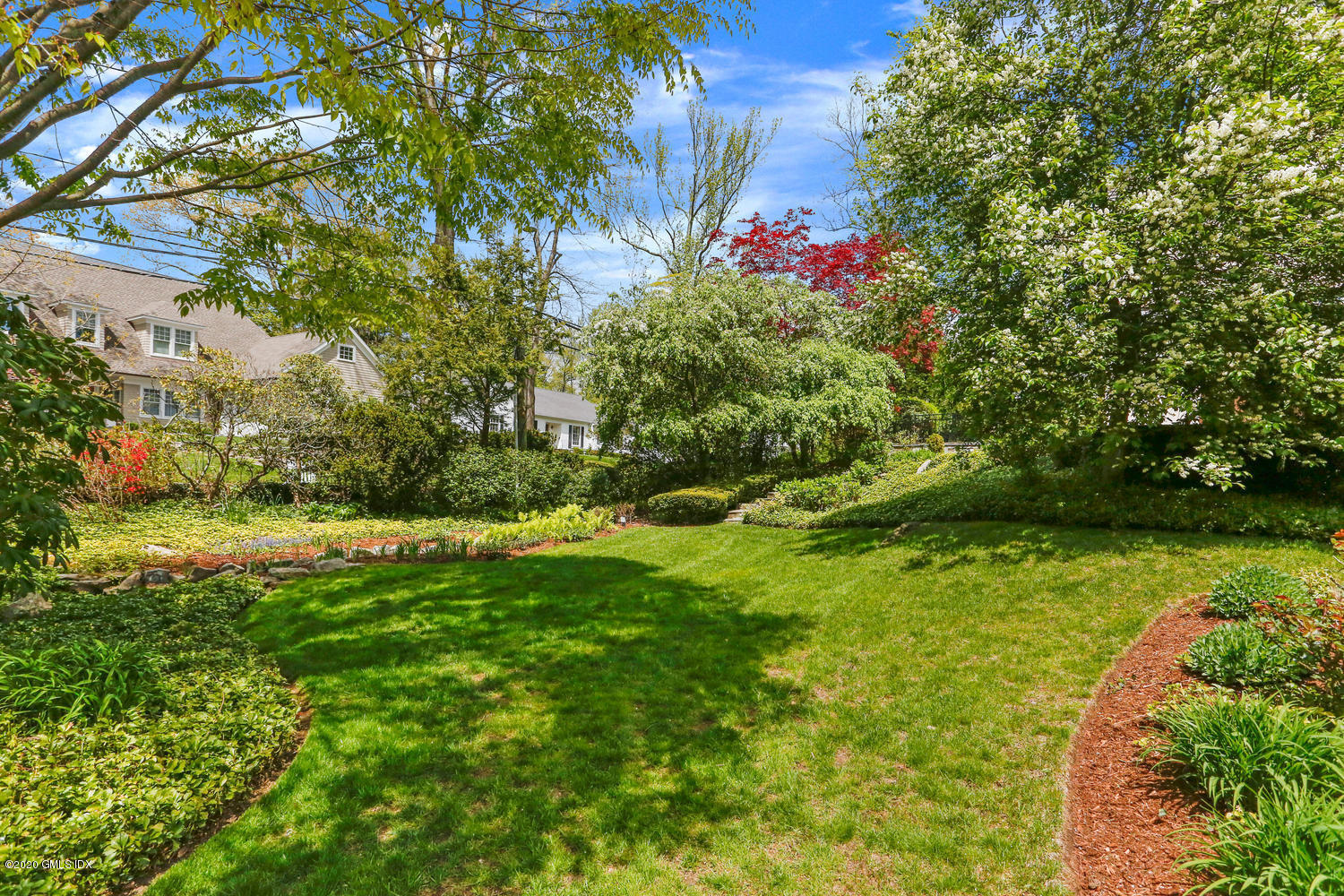 1 Spring Road Greenwich, CT 06830 - Photo 38 of 45 a view of a flower in a yard