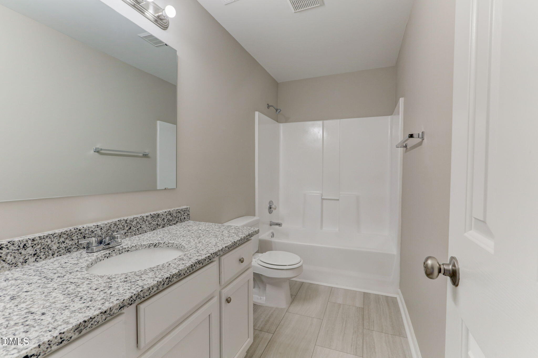 480 Seastone Street Raleigh, NC 27603 - Photo 21 of 26 a bathroom with a granite countertop sink a toilet and shower