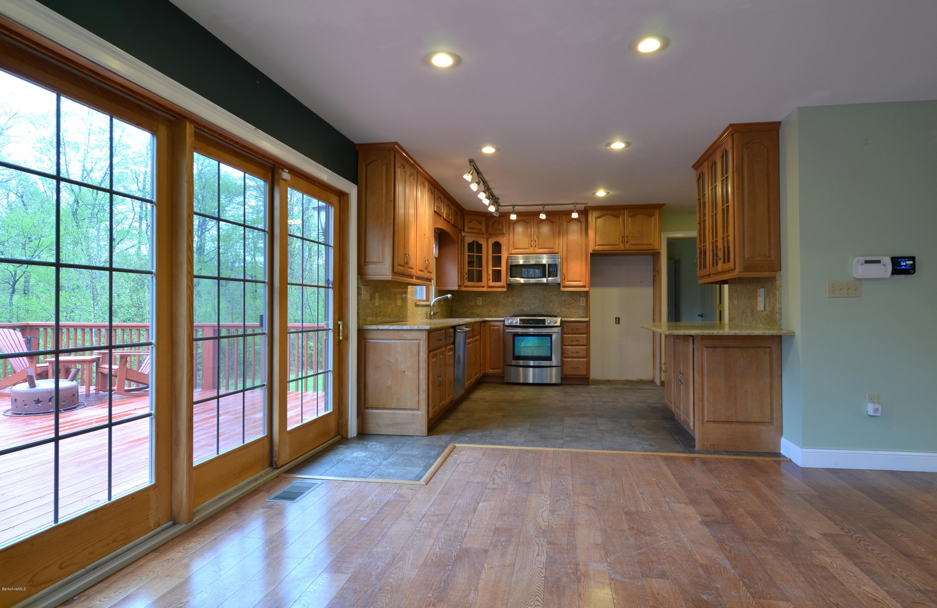 317 Skyline Ridge Road Becket, MA 01223 - Photo 11 of 29 a kitchen with stainless steel appliances granite countertop a refrigerator and a stove top oven