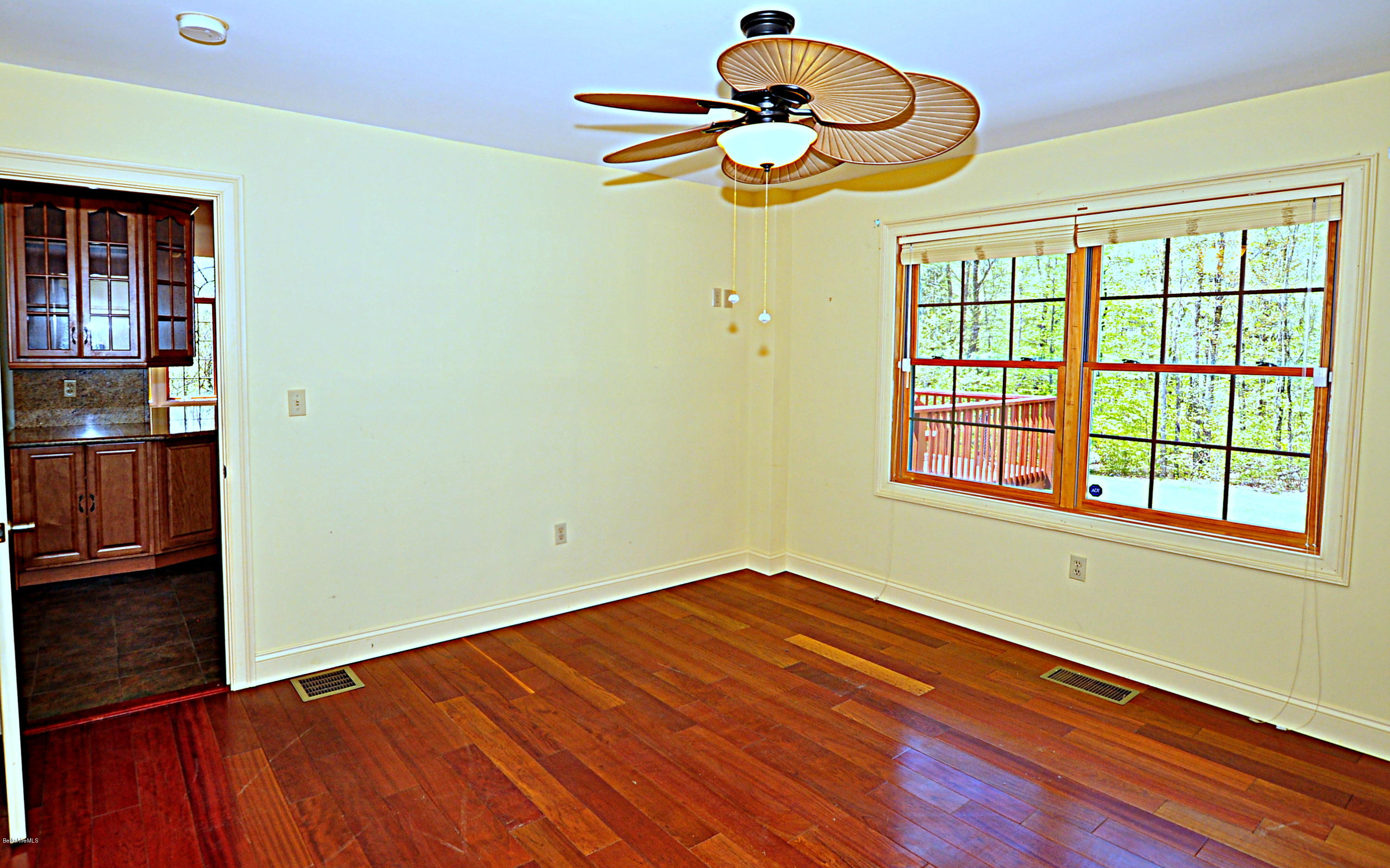 317 Skyline Ridge Road Becket, MA 01223 - Photo 16 of 29 a view of a room with wooden floor and a window