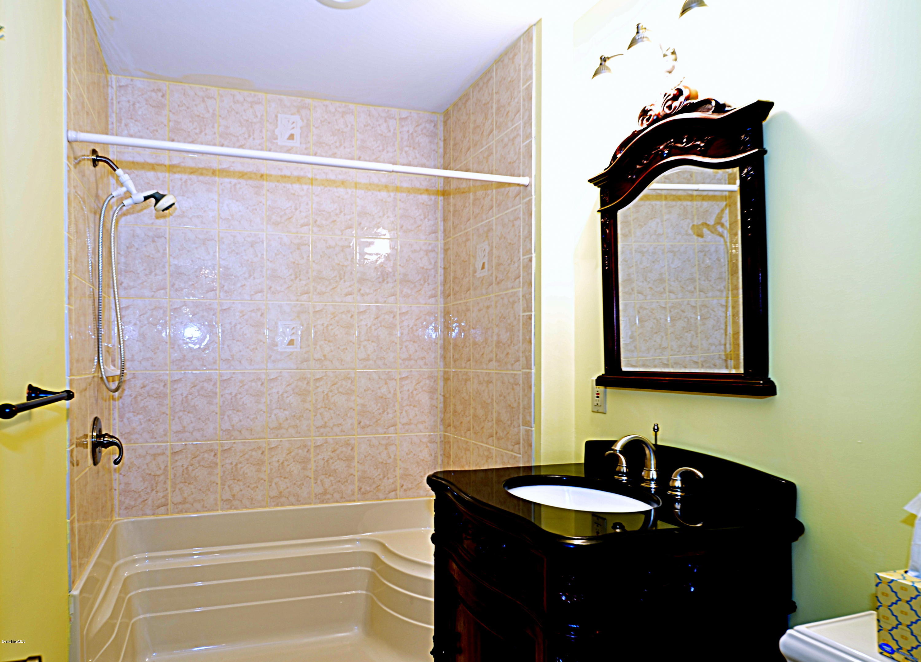 317 Skyline Ridge Road Becket, MA 01223 - Photo 18 of 29 a bathroom with a sink and a mirror