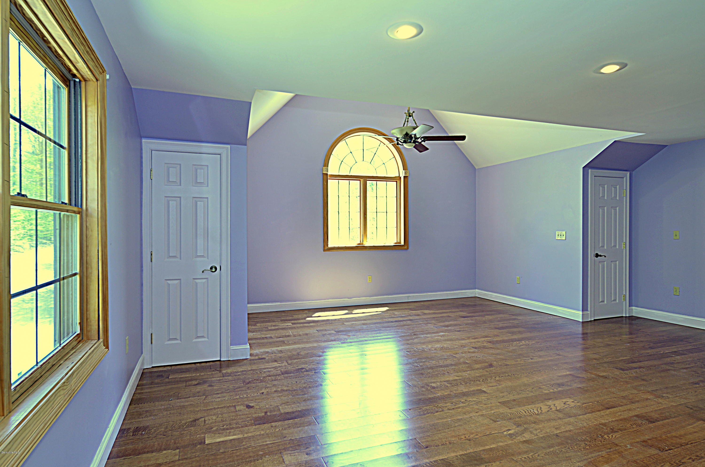 317 Skyline Ridge Road Becket, MA 01223 - Photo 20 of 29 a view of a room with wooden floor window and glass door