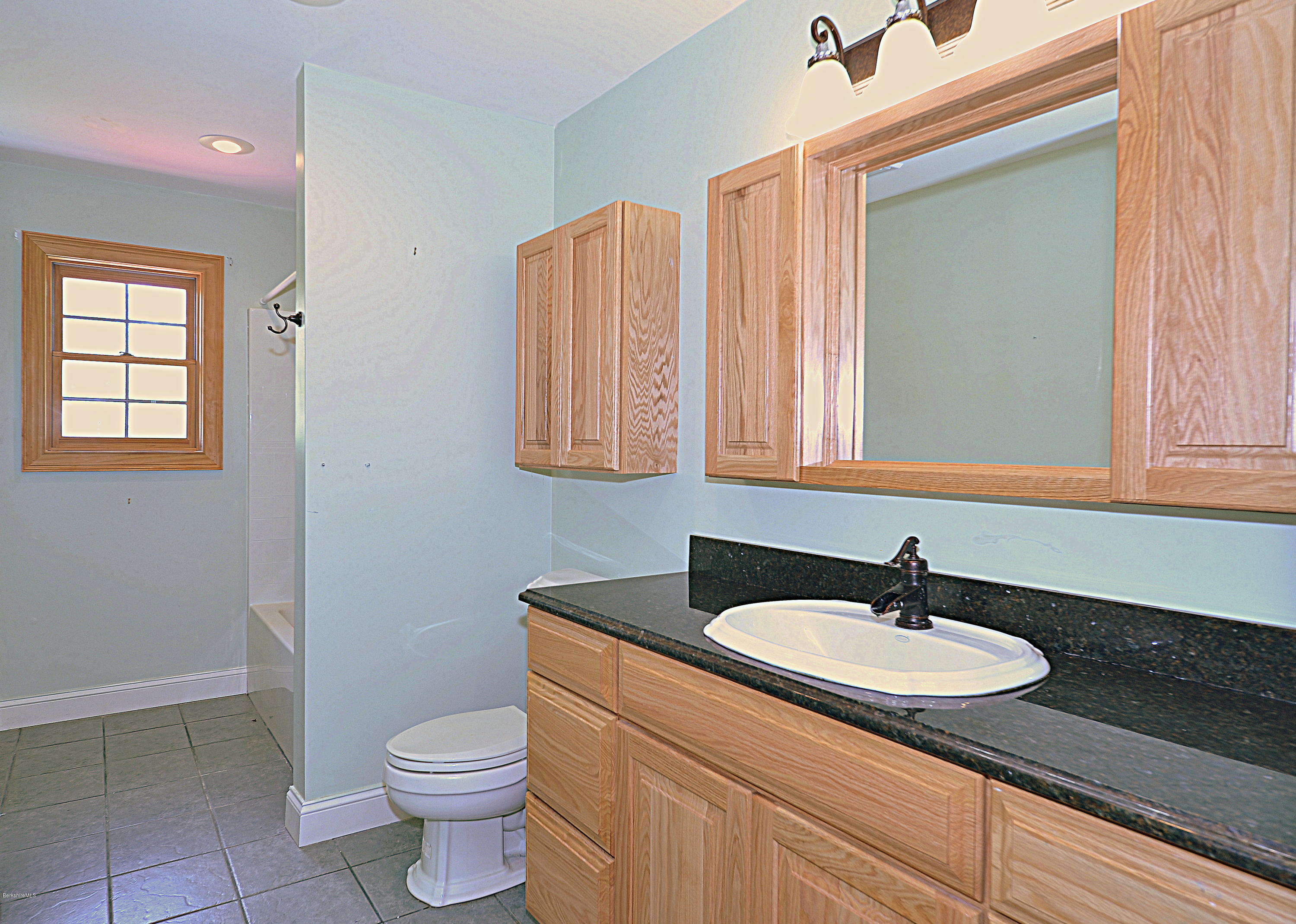 317 Skyline Ridge Road Becket, MA 01223 - Photo 27 of 29 a bathroom with a sink and a toilet