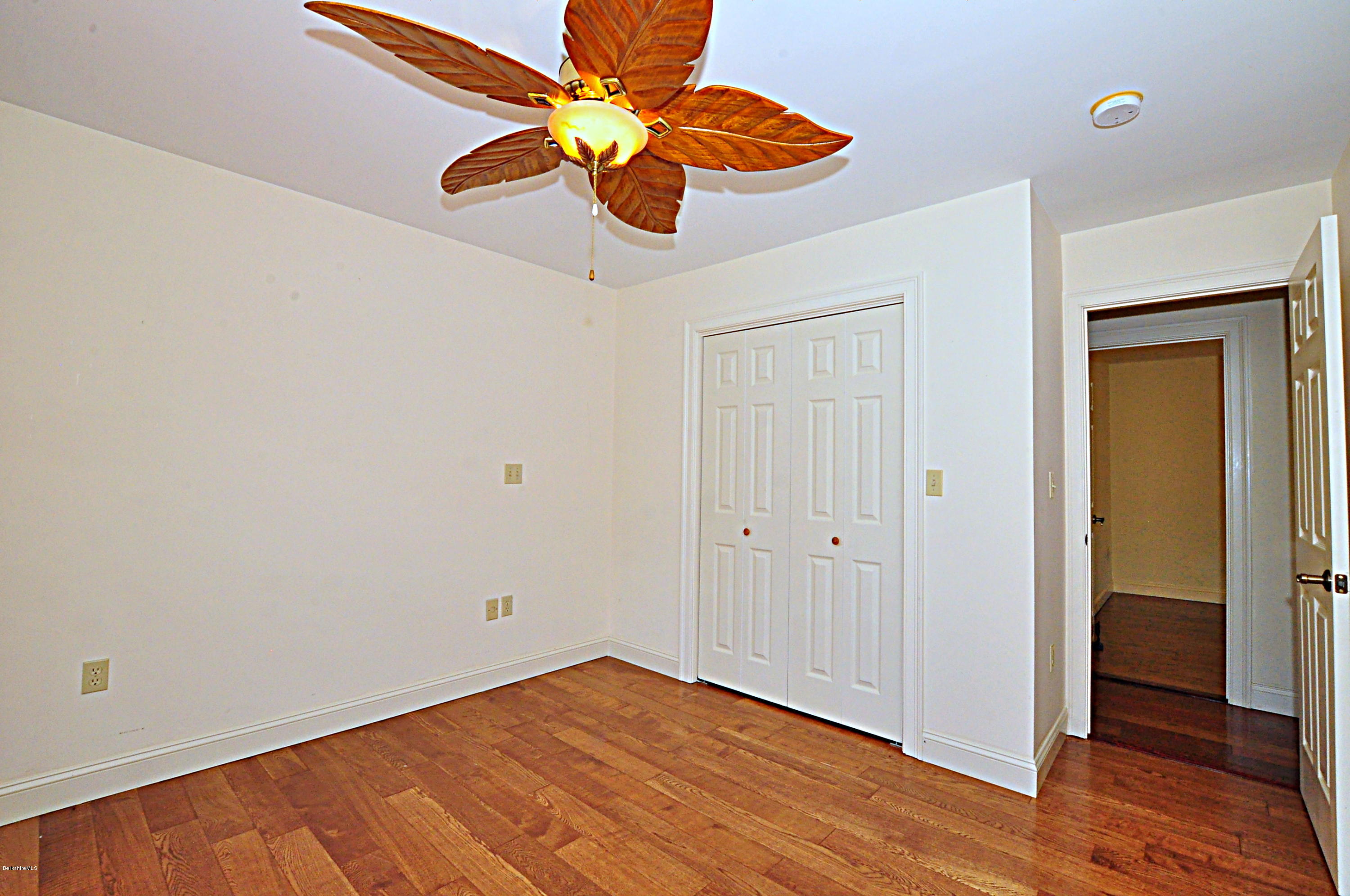 317 Skyline Ridge Road Becket, MA 01223 - Photo 29 of 29 a view of an empty room with wooden floor