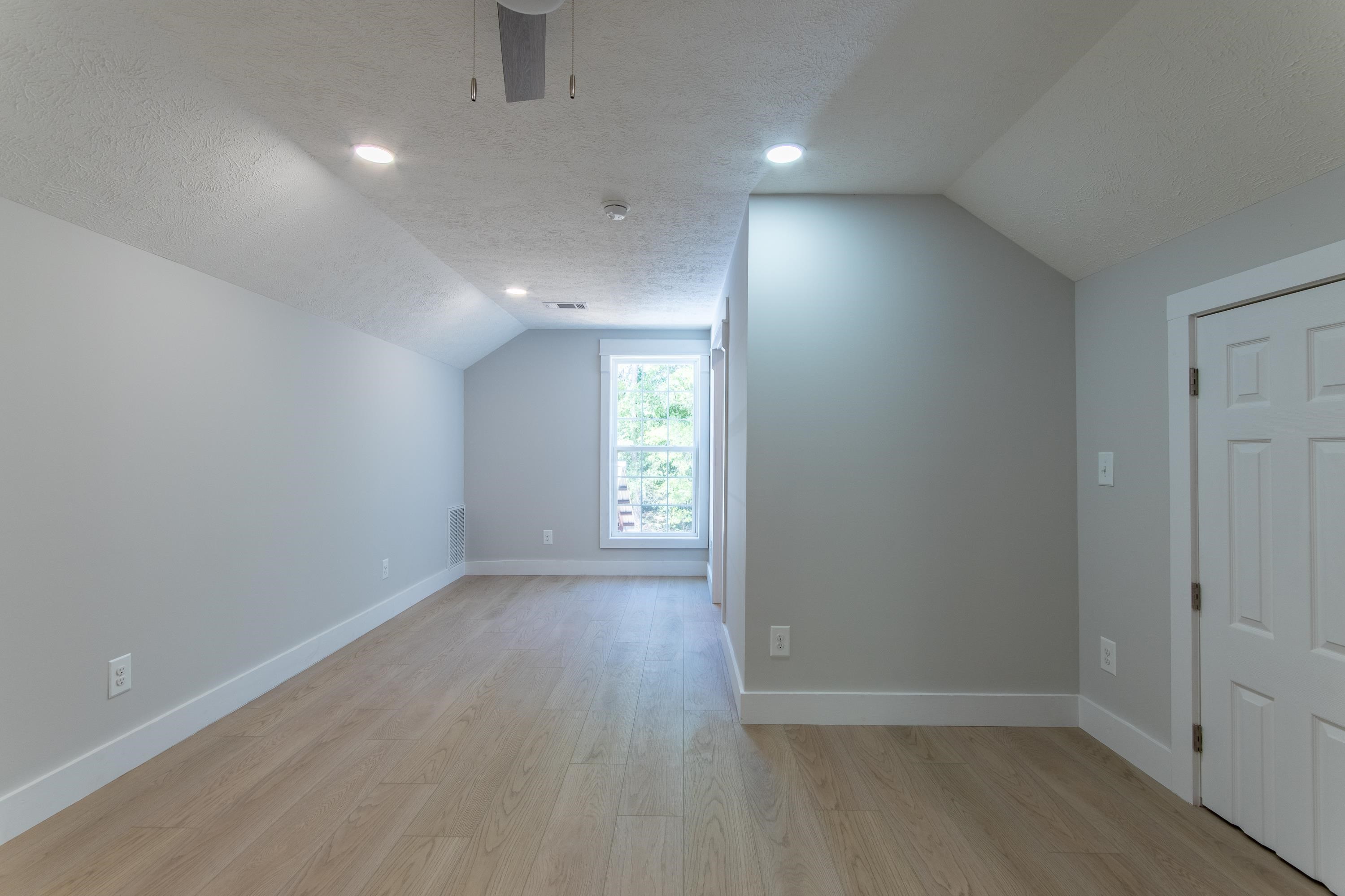 1375 Gin Road Michie, TN 38357 - Photo 21 of 37 Bonus room with vaulted ceiling, a textured ceiling, and light hardwood / wood-style floors