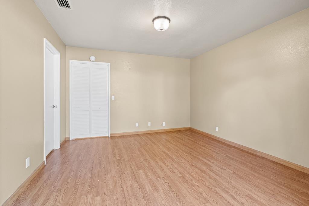 6190 Gerdts Drive San Jose, CA 95135 - Photo 12 of 20 a view of an empty room with wooden floor