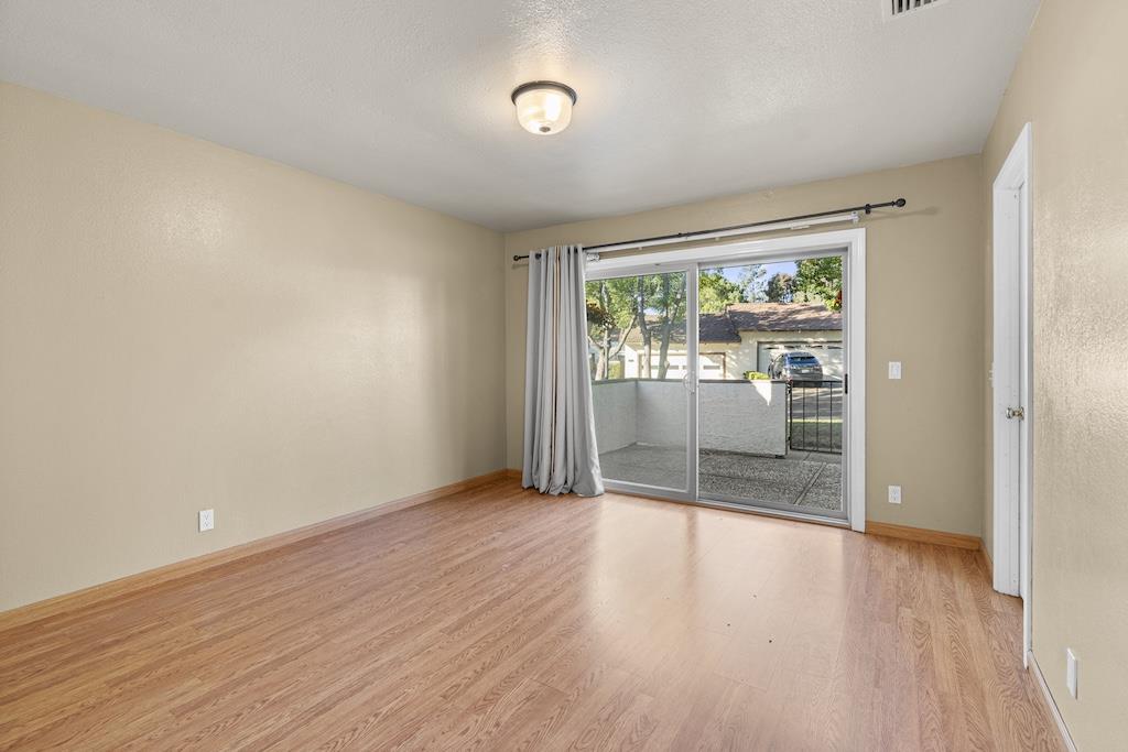 6190 Gerdts Drive San Jose, CA 95135 - Photo 14 of 20 wooden floor in an empty room with a window
