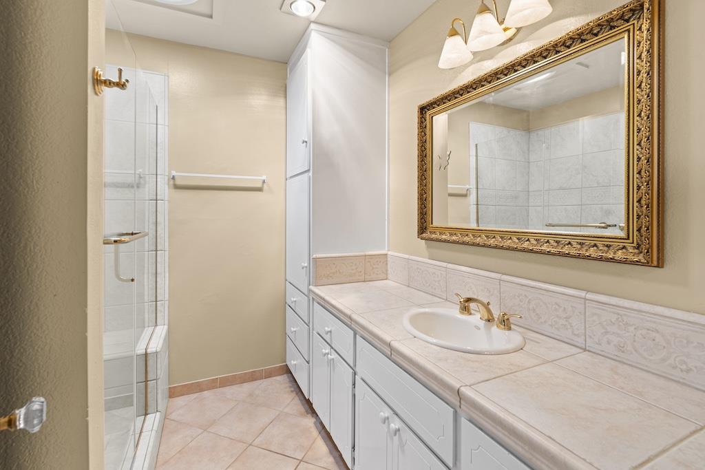 6190 Gerdts Drive San Jose, CA 95135 - Photo 10 of 20 a bathroom with a sink and a mirror