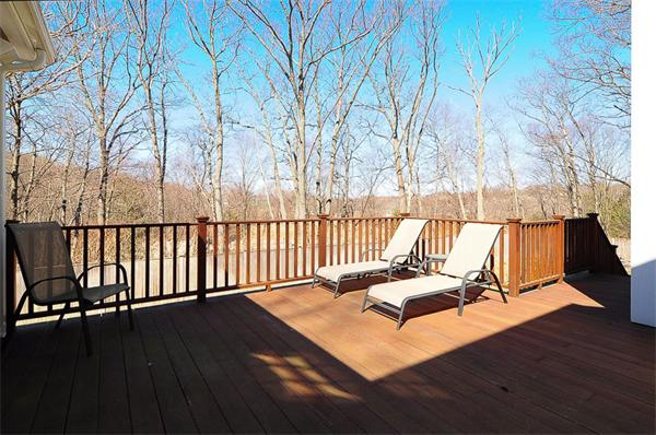 62 Fiske Road Wellesley, MA 02481 - Photo 18 of 25 a view of a roof deck with wooden floor and fence